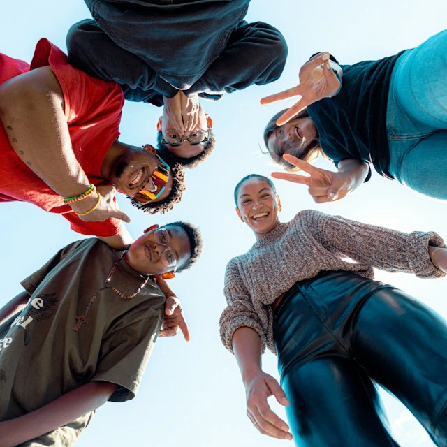 Young people gathered in a circle outdoors