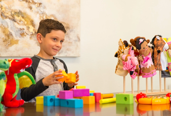A child exploring creative activities in an office