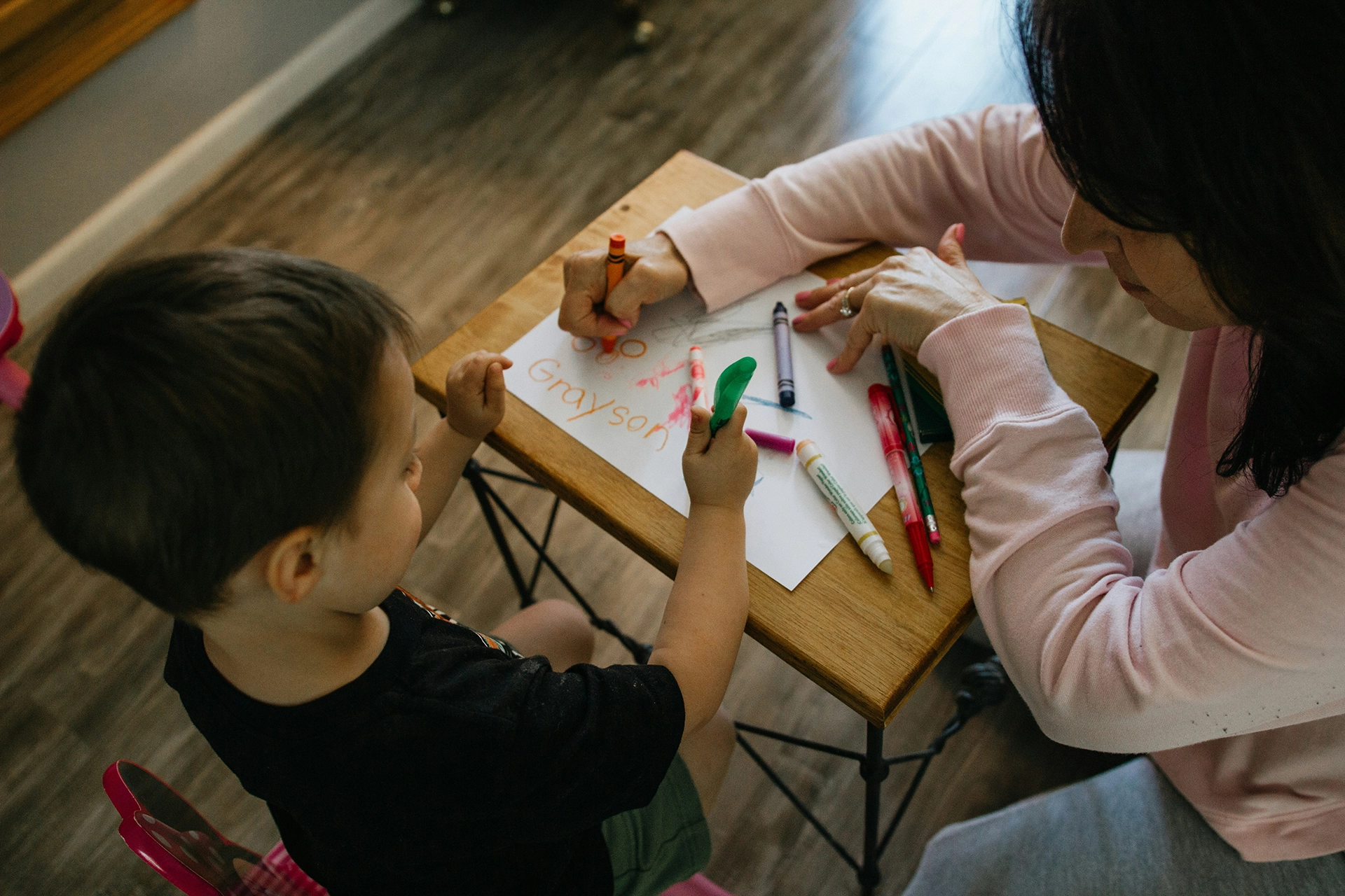 A child and therapist employing play therapy