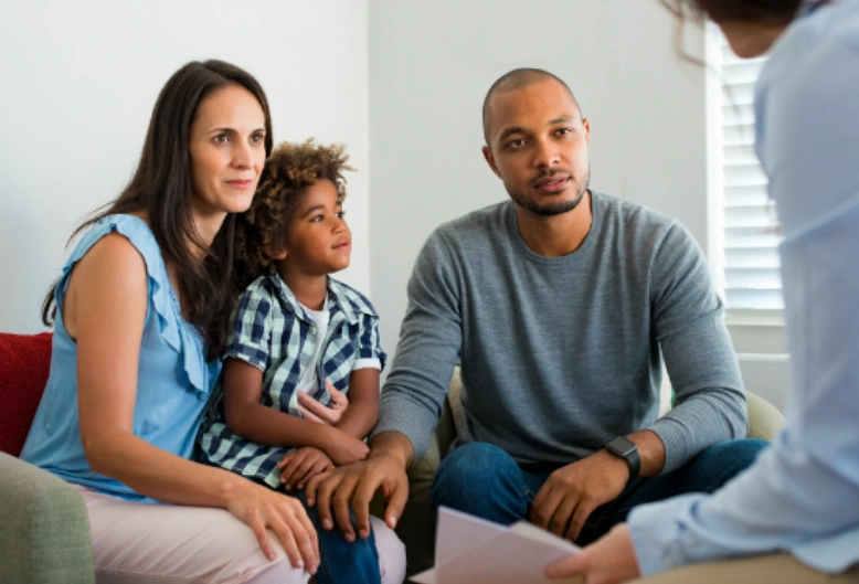 A family speaking with a counselor
