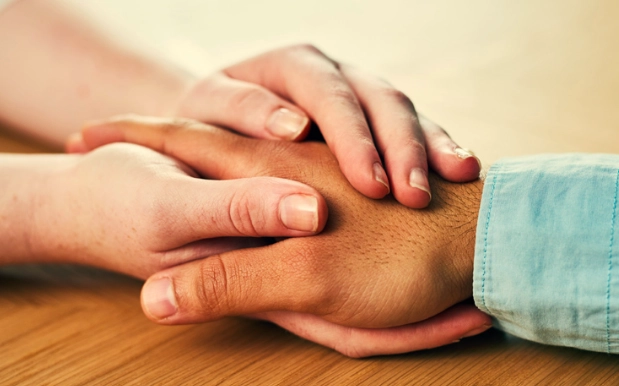 Hands offering a gesture of support